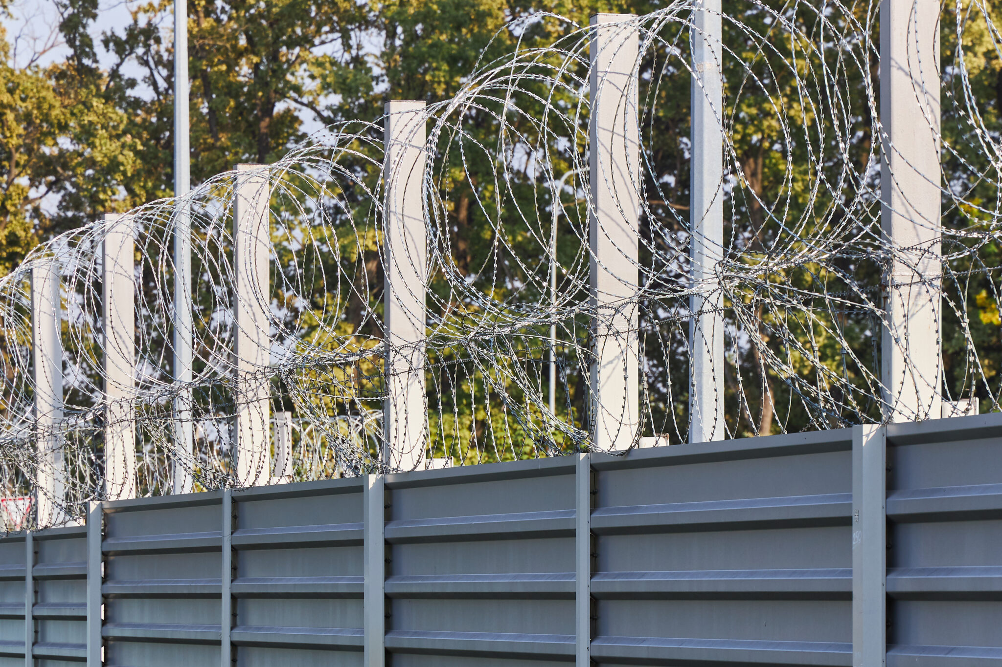 spiral barbed wire on the fence protects against penetration